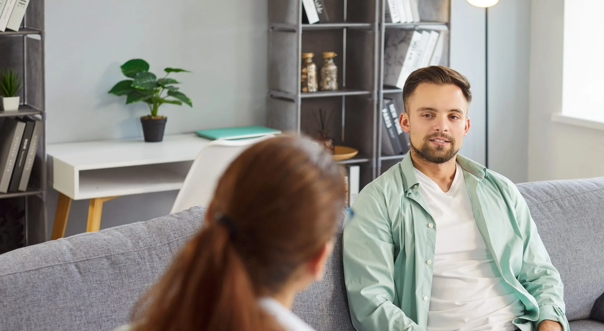 Man smiling during a therapy session