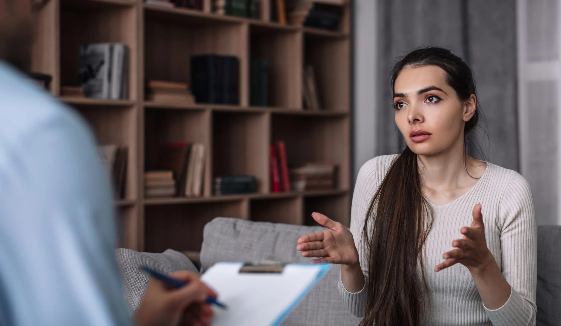 Young woman talking with a therapist