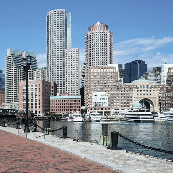 Waterfront cityscape with high-rise buildings and moored yacht