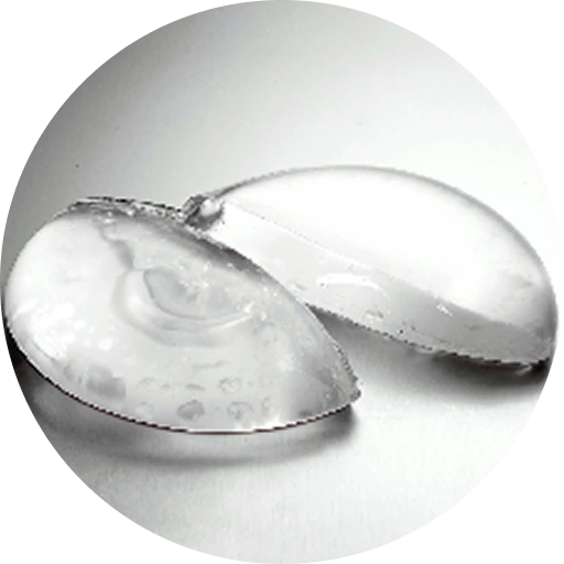 Two silicone breast implants shown from different angles on a neutral background