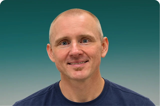 Andrew Engler, support team member at The Allergy and Asthma Clinic, smiling at camera