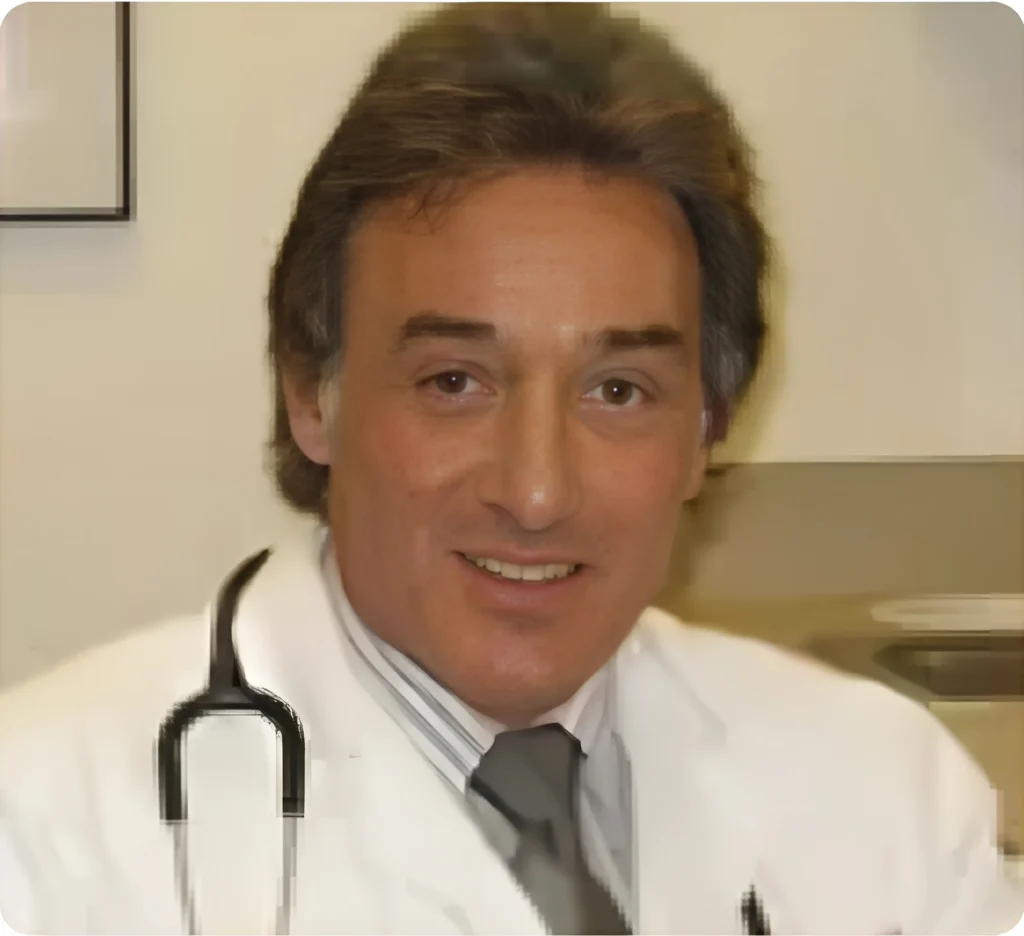 Andrew Engler, Allergy & Asthma Specialist, wearing a white coat and stethoscope