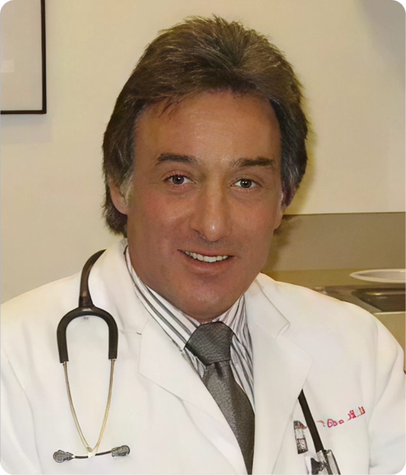 Male allergist in white coat with stethoscope smiling at camera