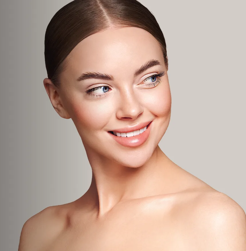 Woman smiling with smooth, contoured neck and jawline showing results after buffalo hump treatment