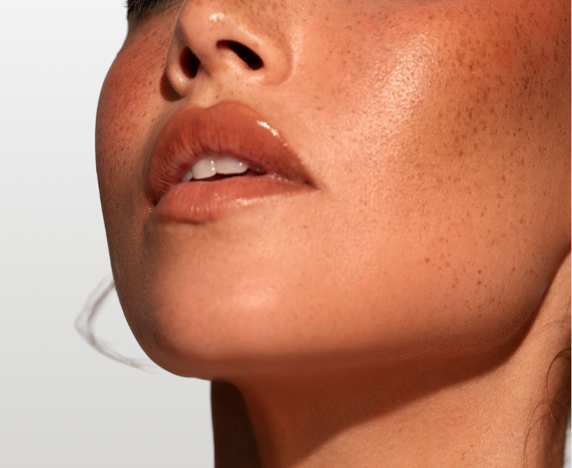 Close-up profile view of a person's jawline, chin, and lower face
