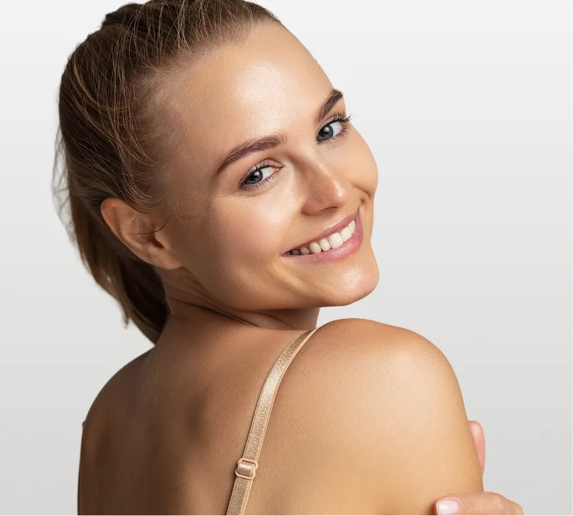 Woman turning to show side profile of neck and upper back with smooth contours