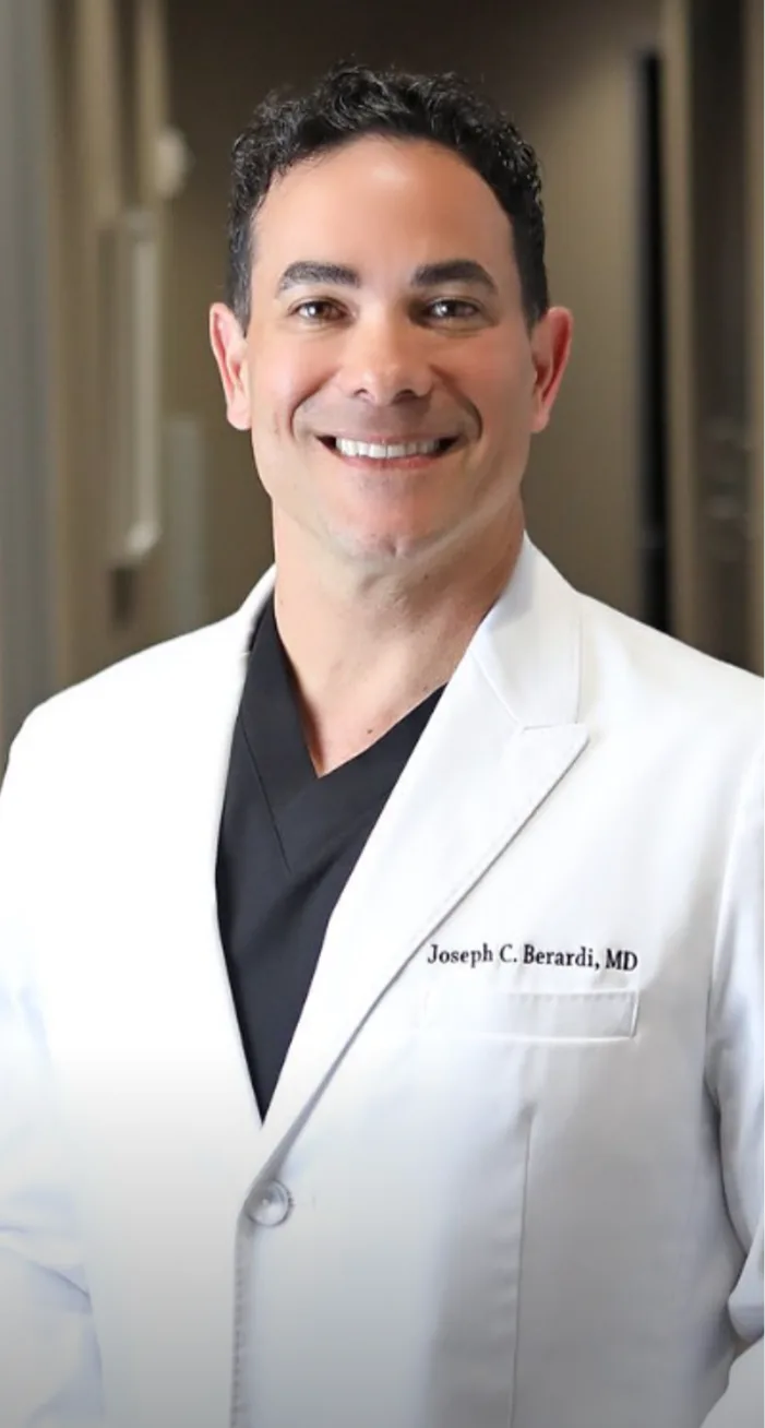 Joseph C. Berardi, MD in white coat and stethoscope