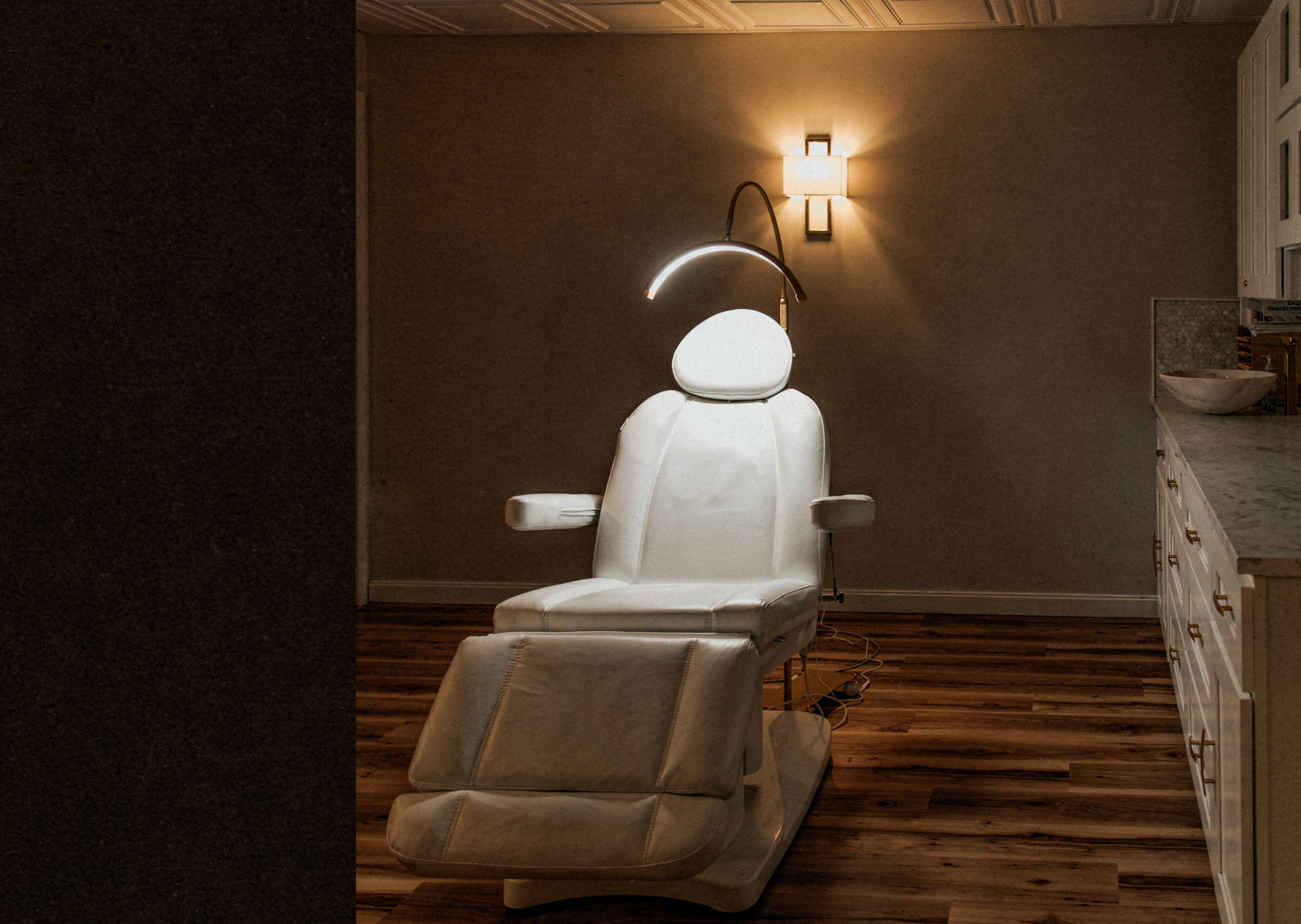 Treatment room with medical chair at Thrive Med Spa