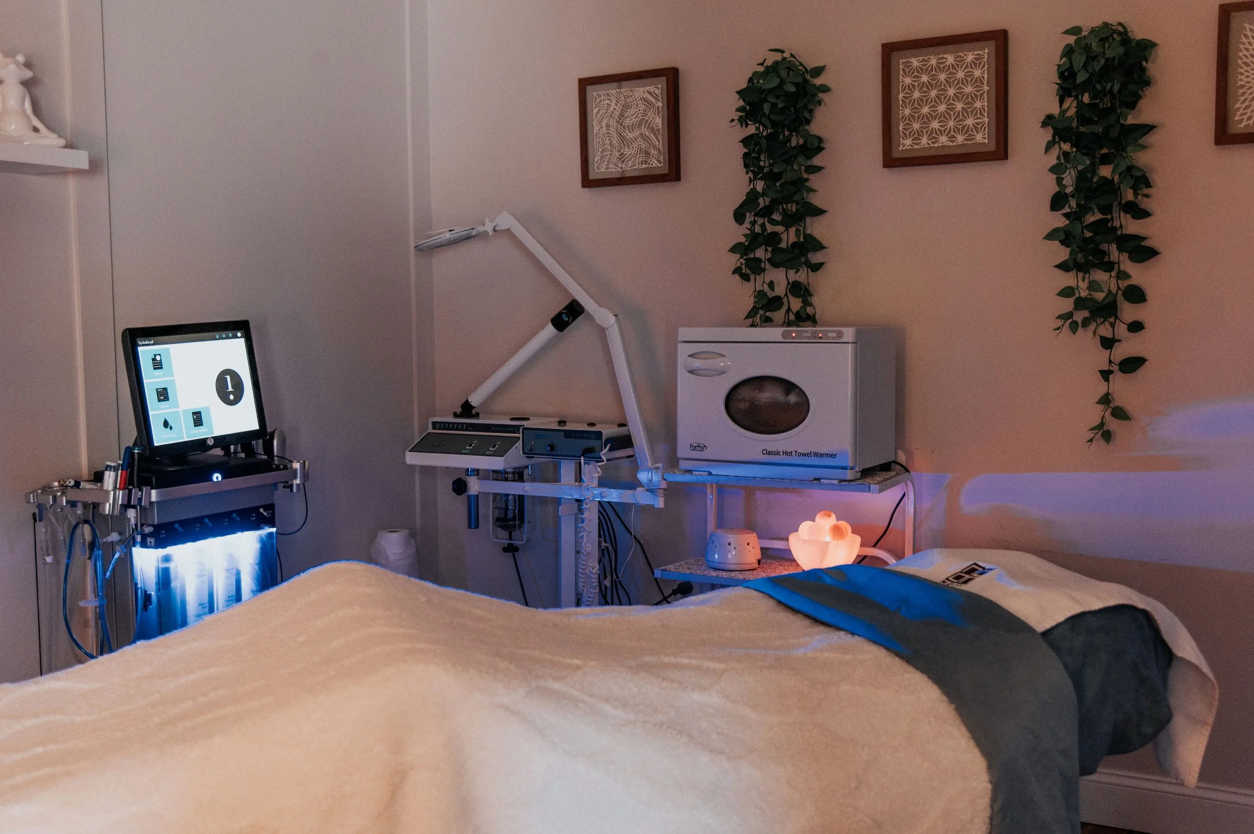 Patient lying on treatment bed during Glimpse Skin Scan analysis at Thrive Med Spa Portsmouth