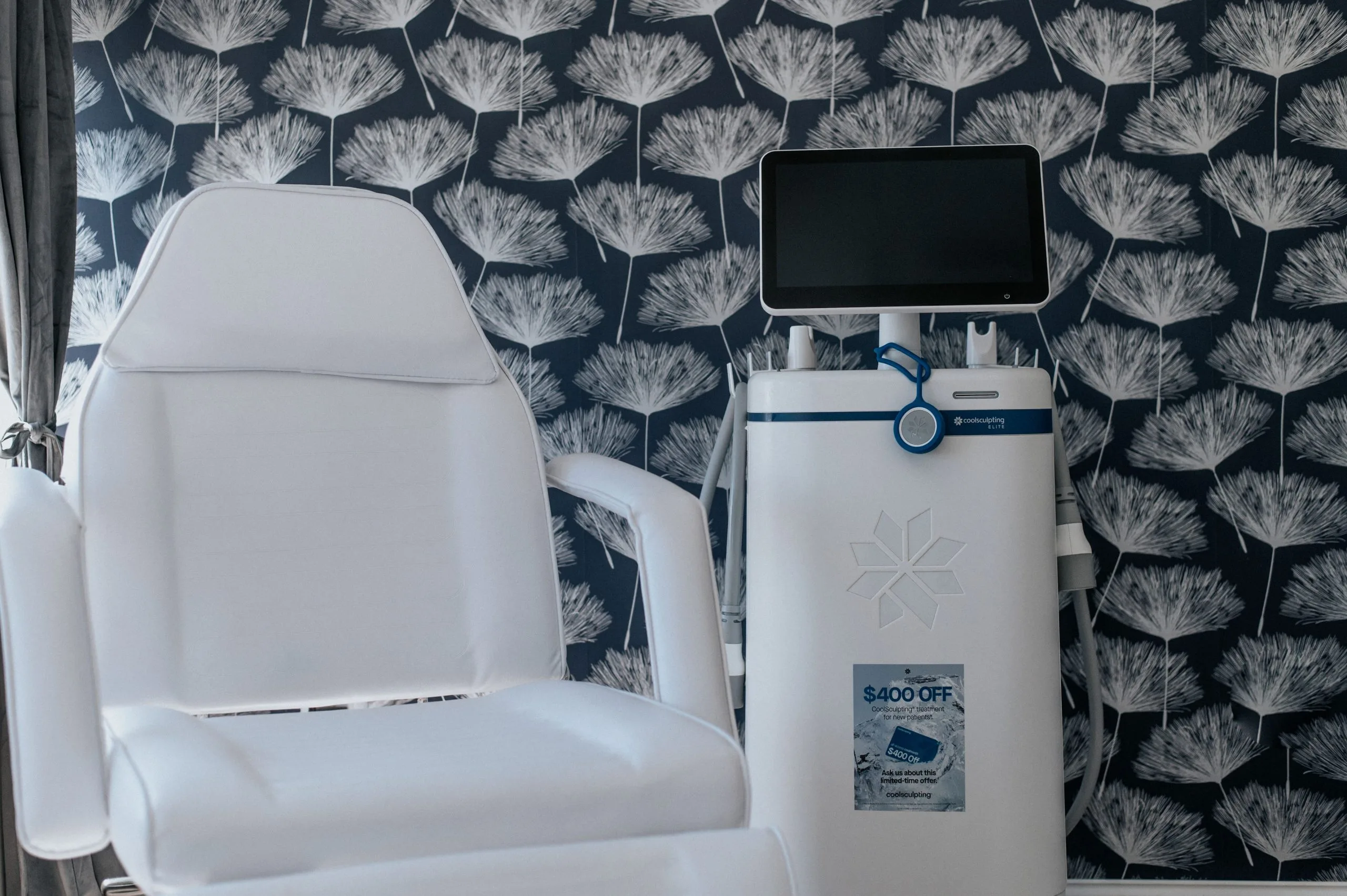 CoolSculpting device next to treatment chair in Thrive Med Spa treatment room