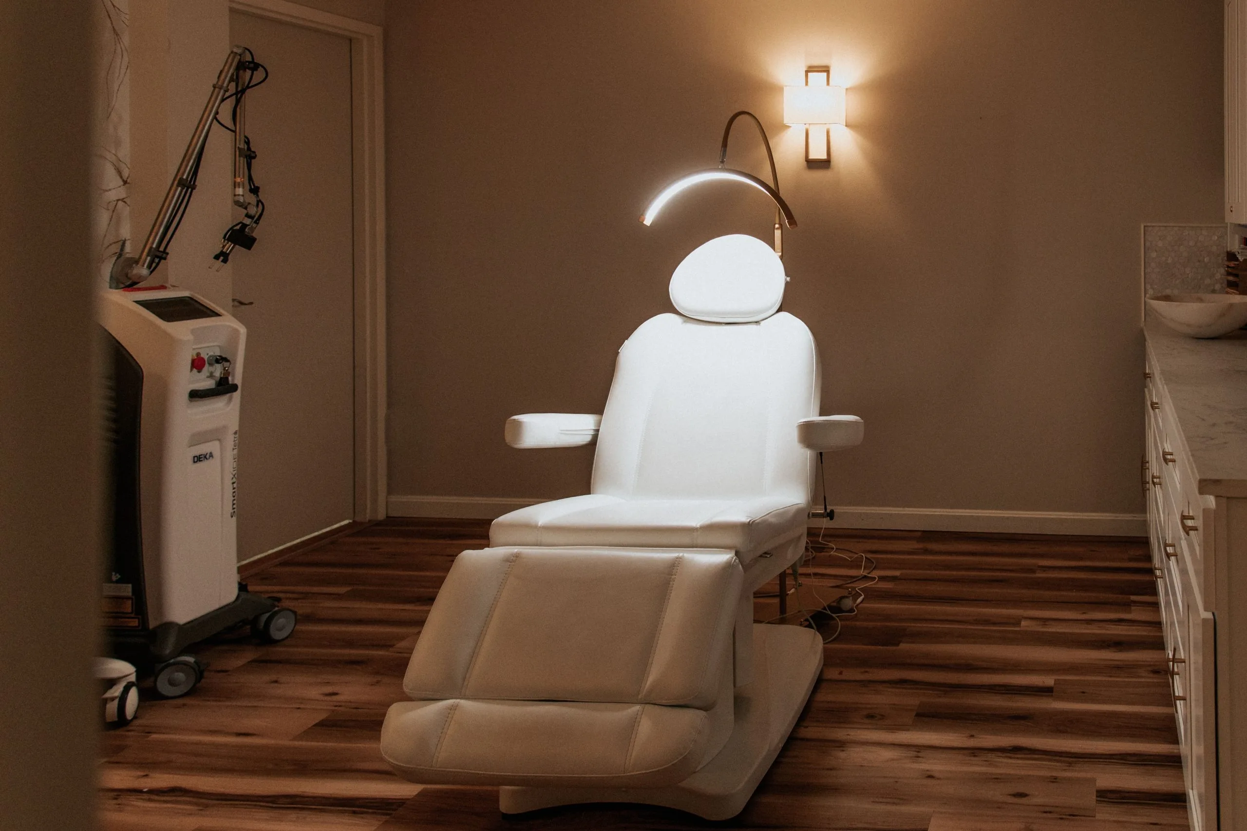 Advanced treatment room at Thrive Med Spa with exosome therapy equipment and patient chair under overhead lighting