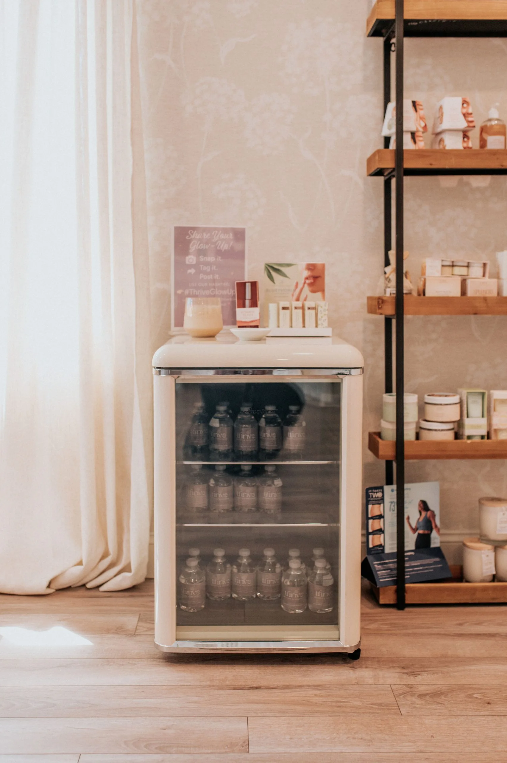 Thrive Med Spa retail display and beverage fridge