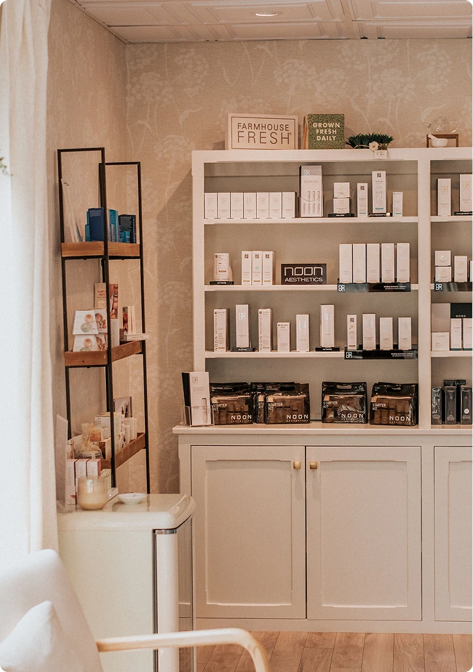 Thrive Med Spa product display shelving with skincare lines and wellness products in neutral tones