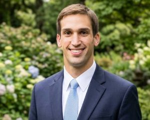 Daniel, a provider at Harmony Neurocare, smiling outdoors in professional attire