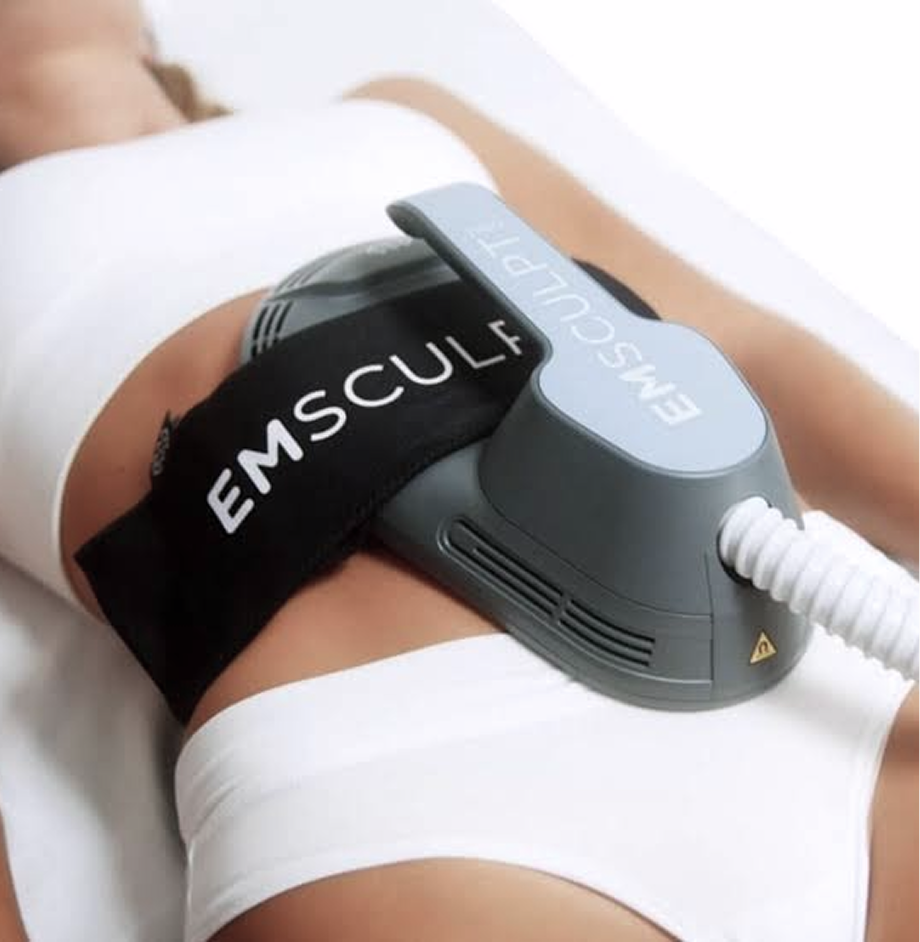 EMSculpt device applicator being held against a patient's abdominal area during a body contouring treatment