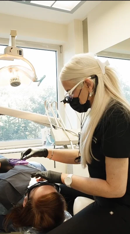 Dr. Victoria Veytsman working chairside on a veneer patient in Manhattan