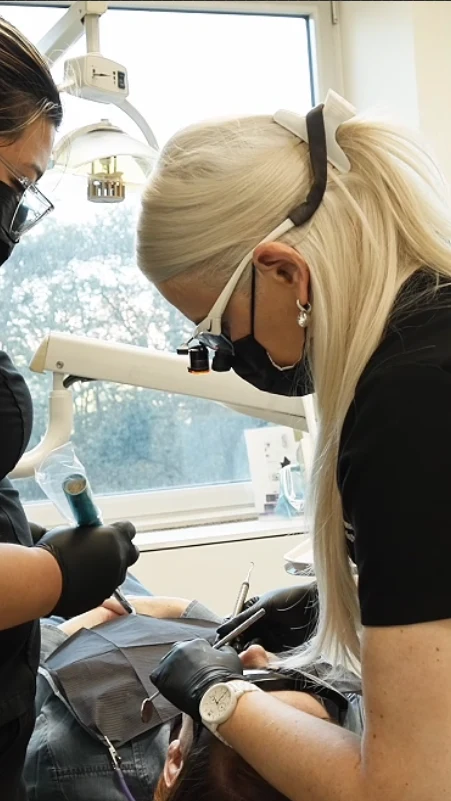 Dr. Victoria Veytsman treating a patient chairside, planning the smile around the face
