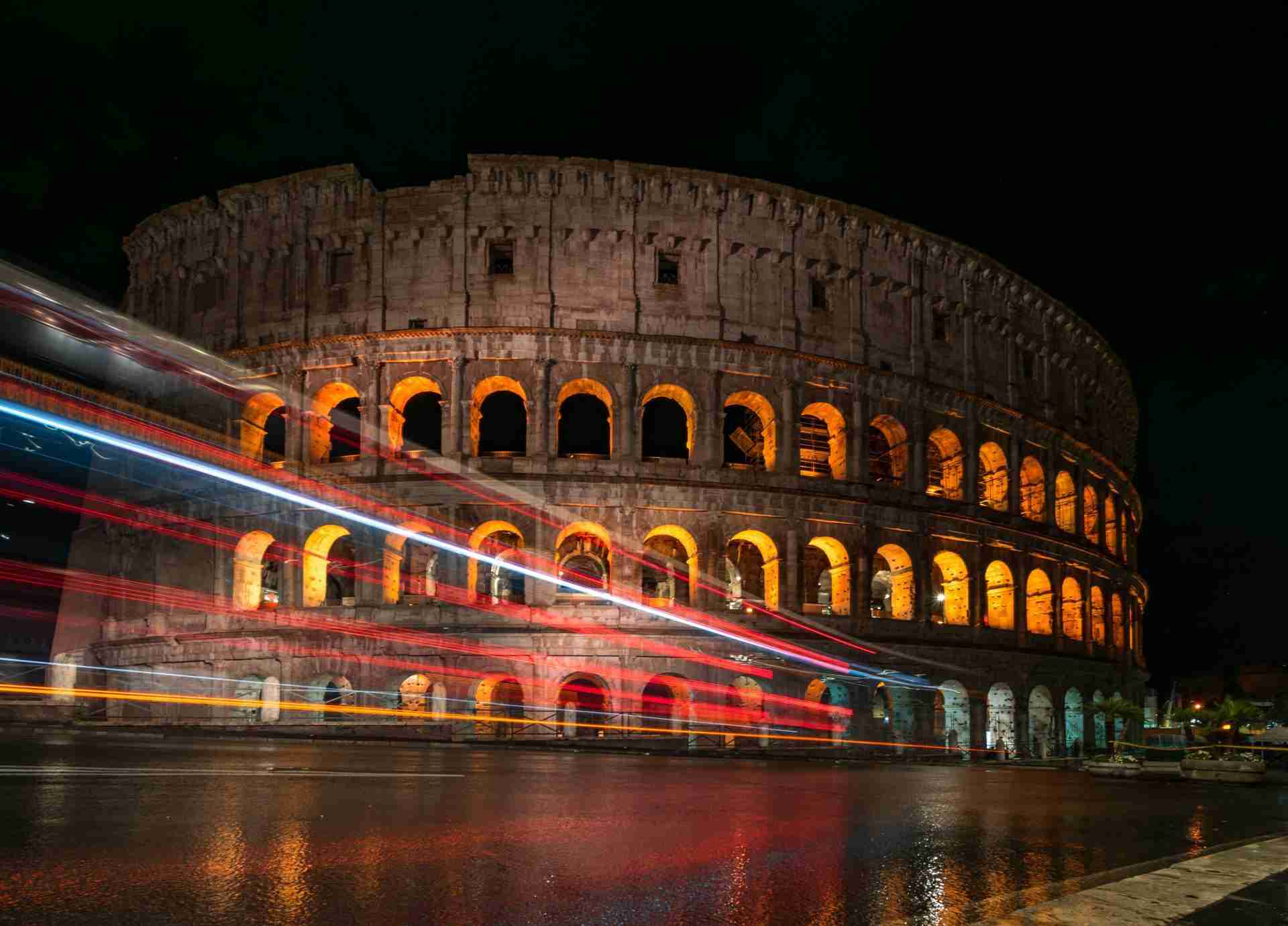 A tripod and long exposure at nights can create amazing light trails at the Colosseum-Photo by Peter Mizsak