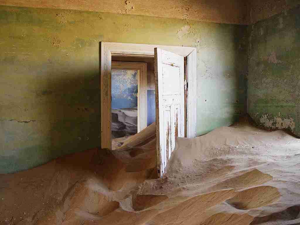 Sand Overtaking a Room in Kolmanskop — Photo by Damien du Toit