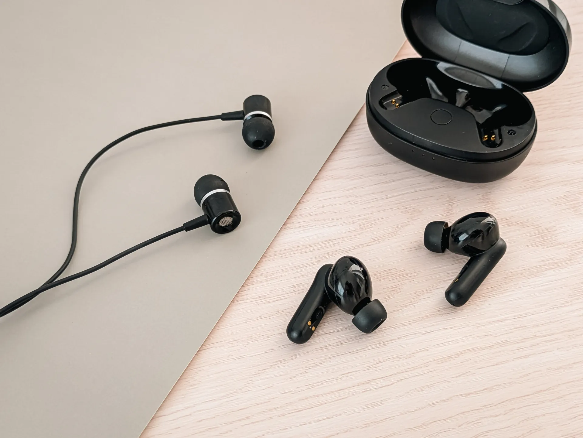 Wireless and wired earphones side by side