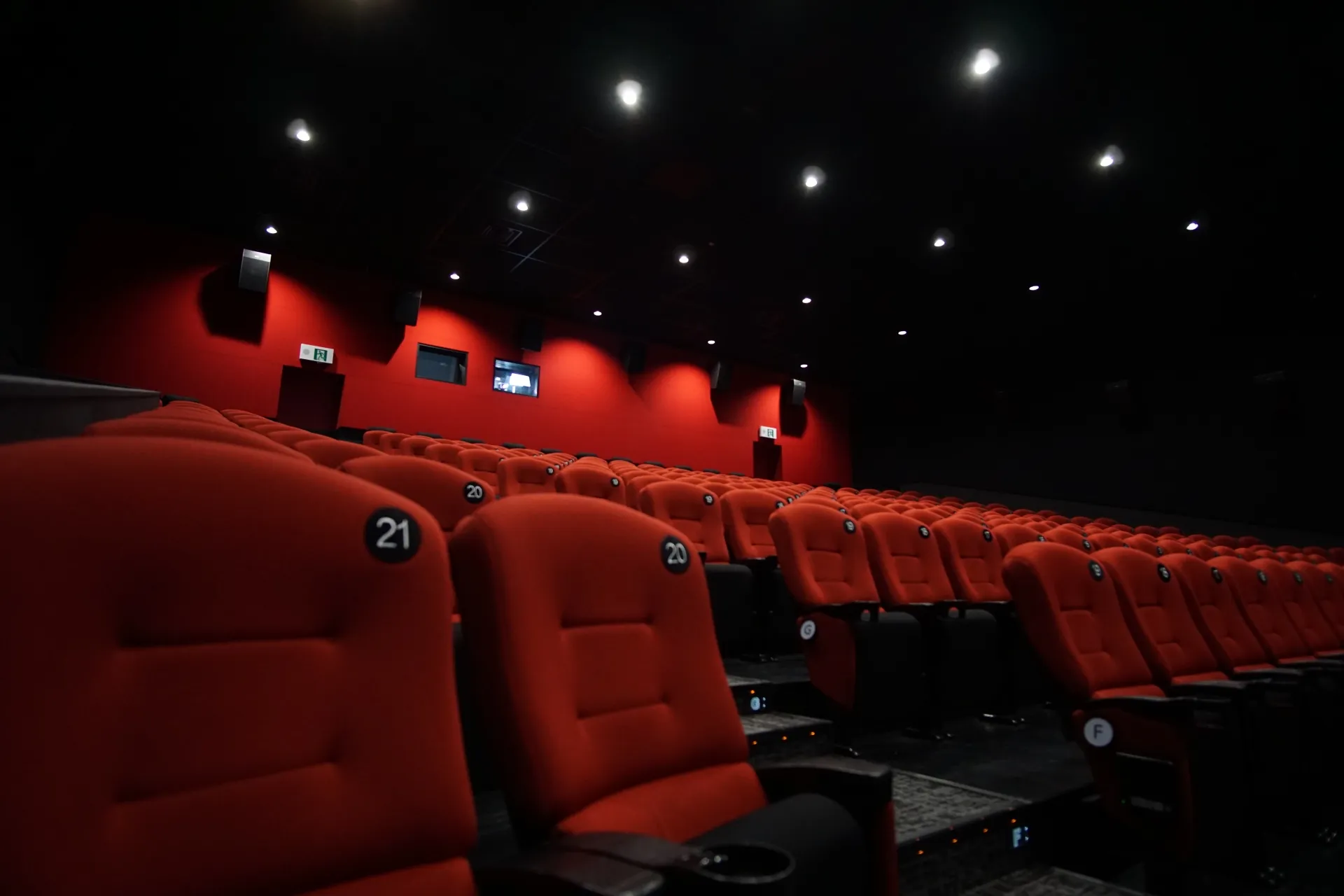 Seats in a dimly lit theater
