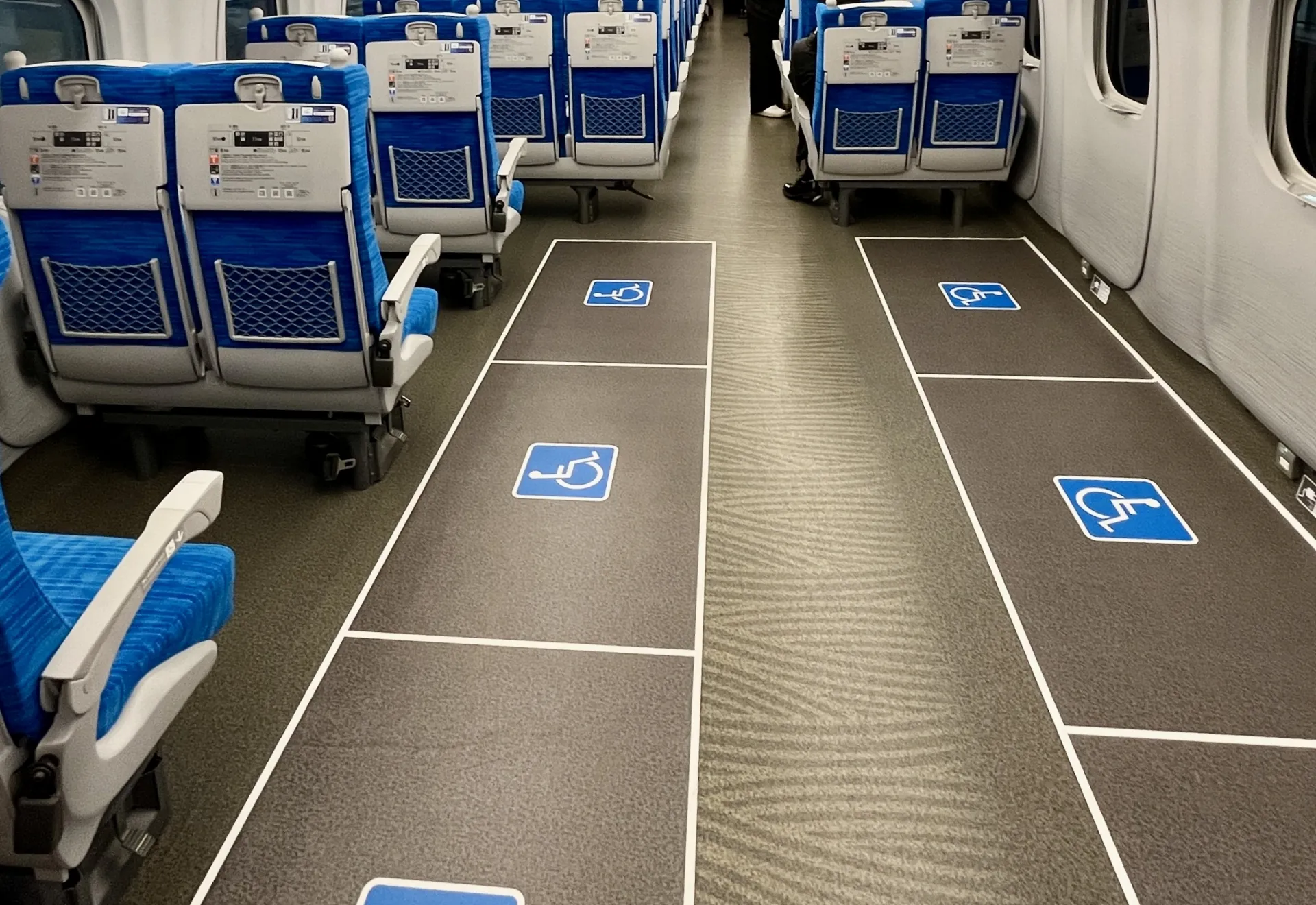 Wheelchair space and adjacent seat inside a Shinkansen train