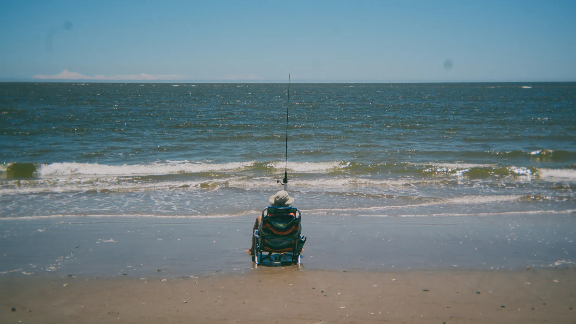 Person enjoying sea fishing while in a wheelchair