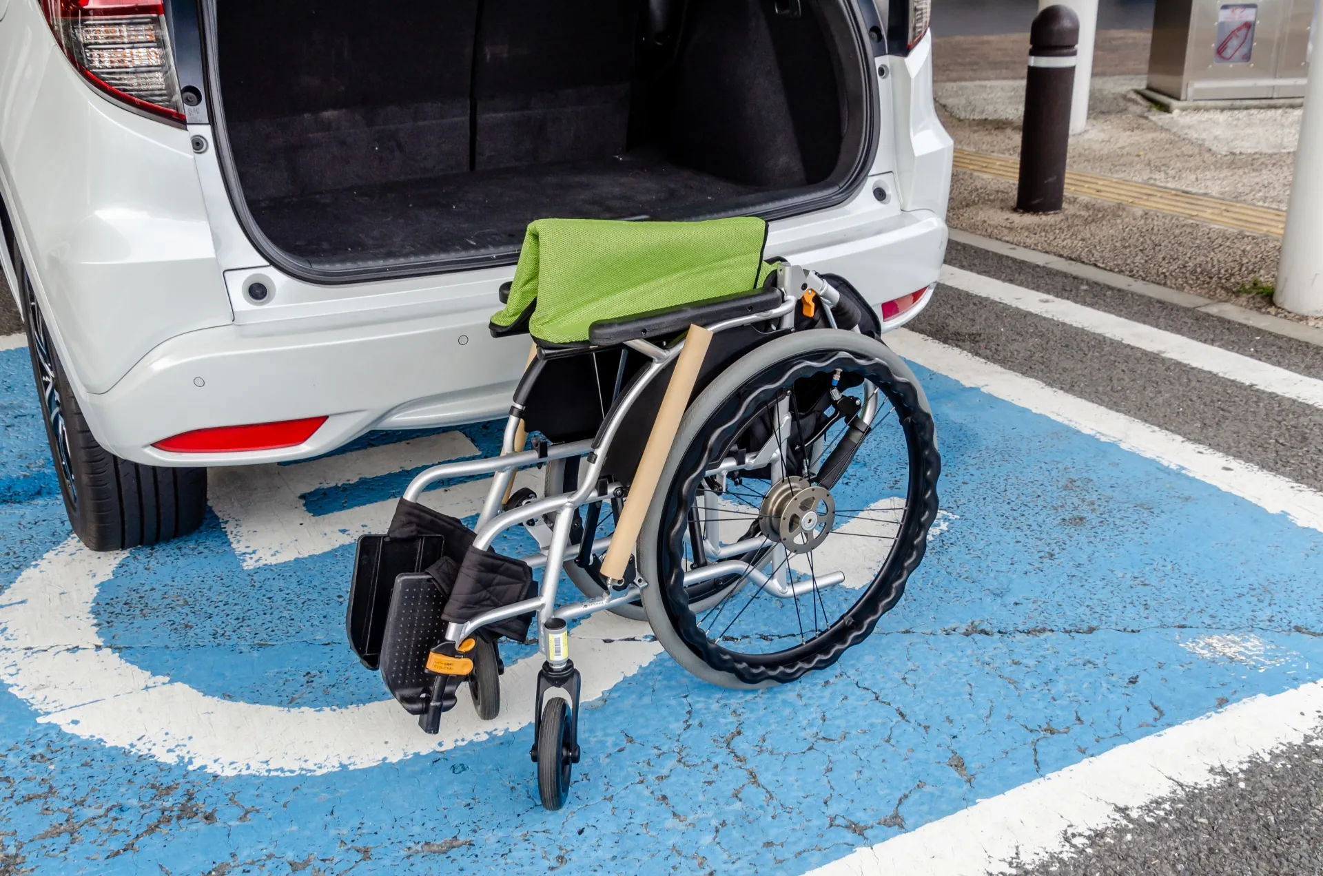 Wheelchair accessible parking space and wheelchair