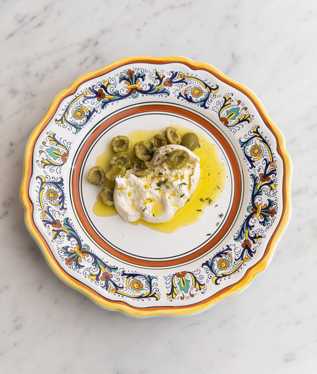 burrata and green olives with olive oil