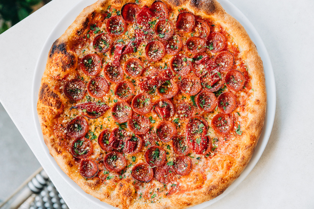 Charred Pepperoni pizza with Ezzo Pepperoni, Mozzarella, Mama Lil's Peppers, Portofino Hot Honey