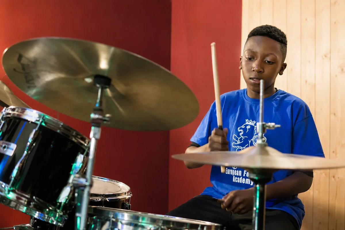 Child trying a drum taster lesson with a Planet drum tutor in London