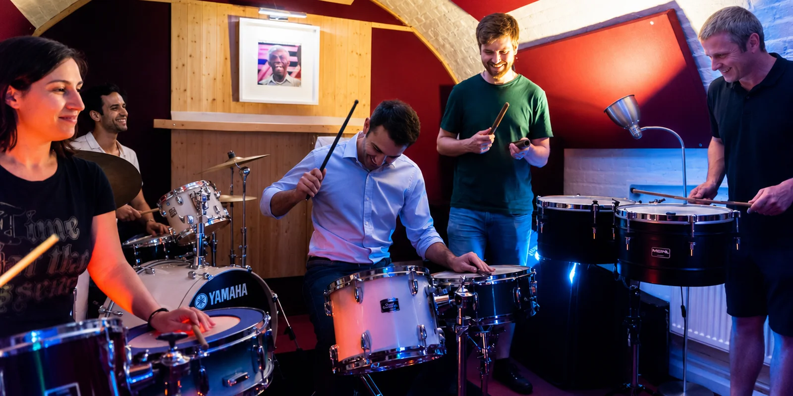 A team drumming workshop session at Planet drum's Crypt studio
