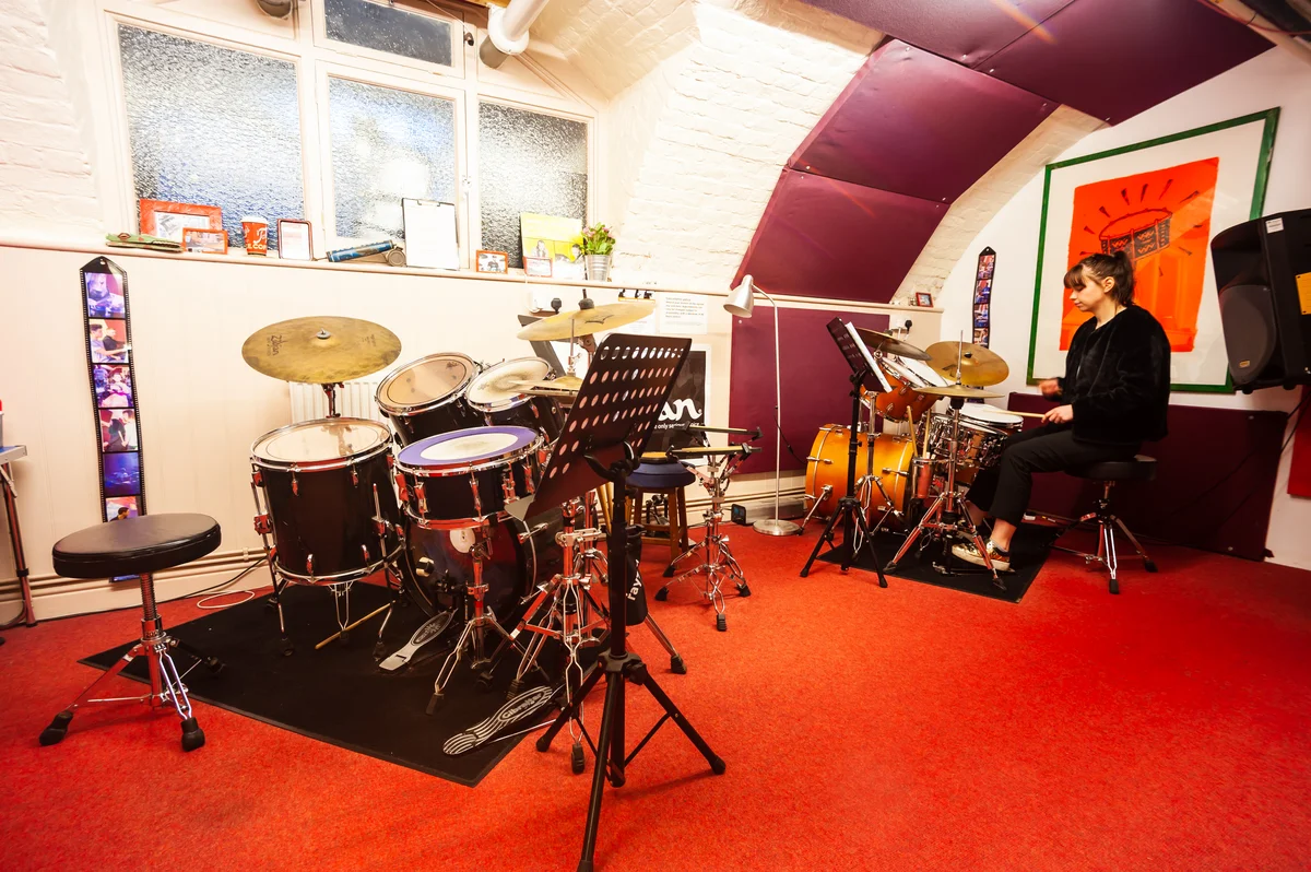 Photo of a drummer practising in a Planet drum drum room in Islington