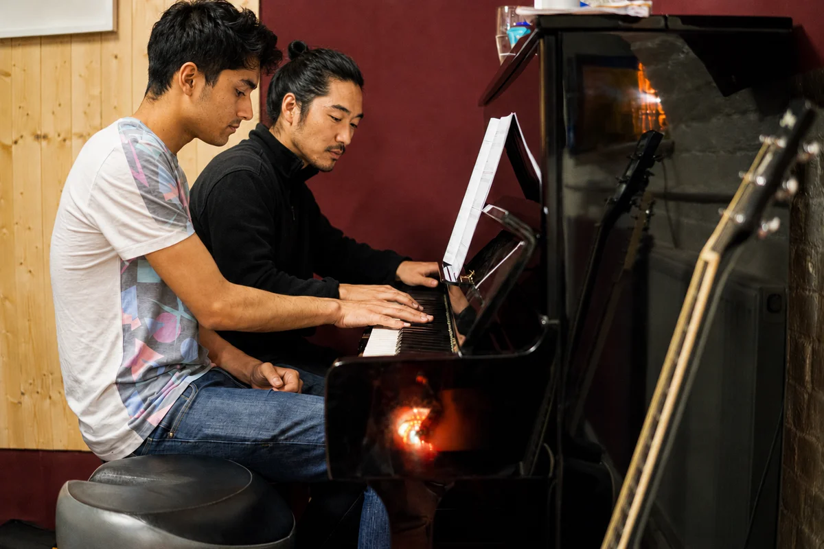 Adult student in a piano taster lesson at Planet drum's Islington studio