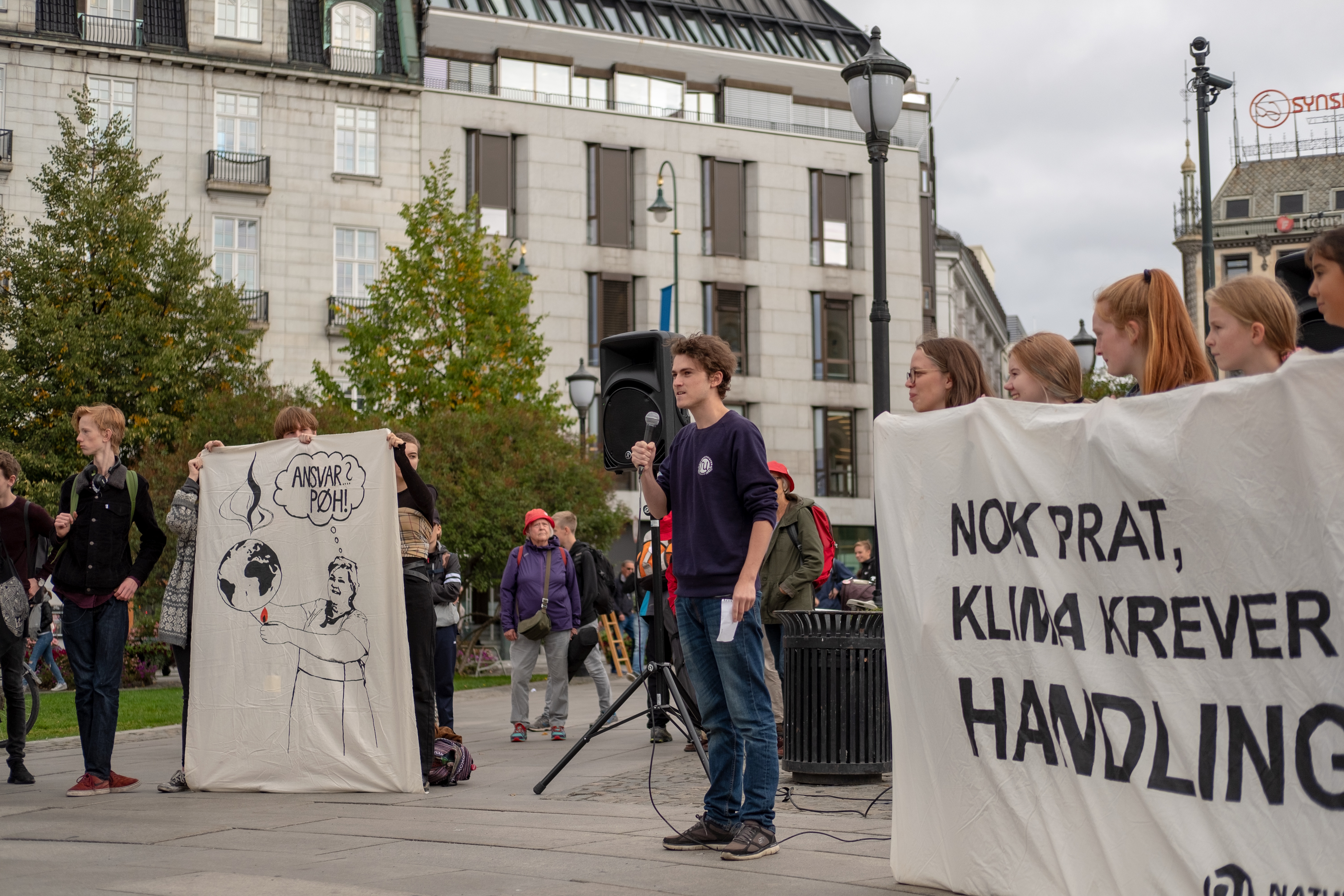 Andreas Randøy speaking at a climate rally in Norway