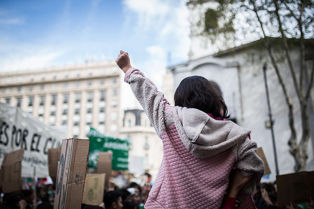 ©Nicolás Villalobos/Greenpeace Young activist at a climate march in Buenos Aires, Argentina