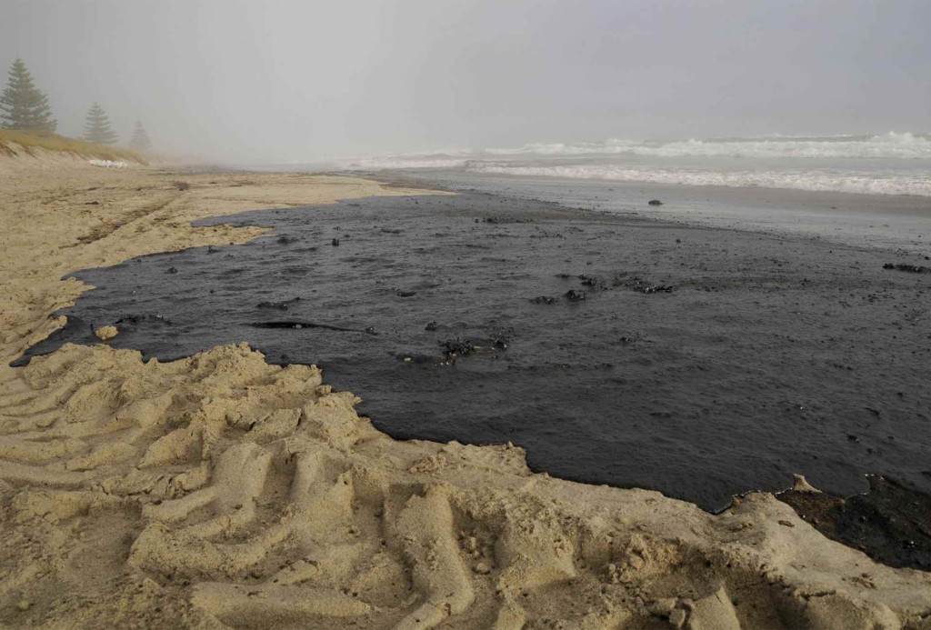 Oil covers a section of Papamoa beach, spilled from the Rena, a container ship which ran aground the Astrolab Reef, about 20km from Tauranga on October 5th.