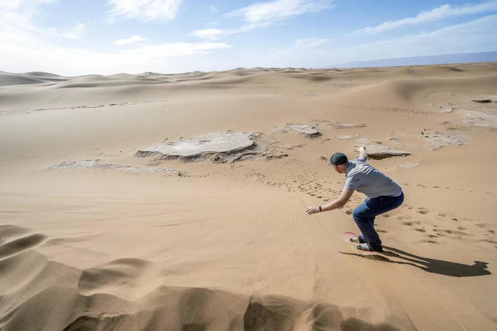 Sandboarding in the Sahara dunes
