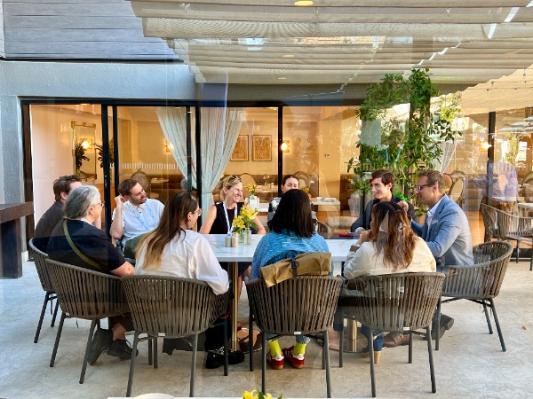 People sitting at a large table indoors