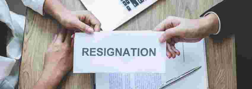 employee-handing-over-resignation-letter-to-employer