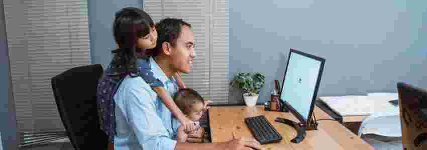 father-working-from-home-with-children