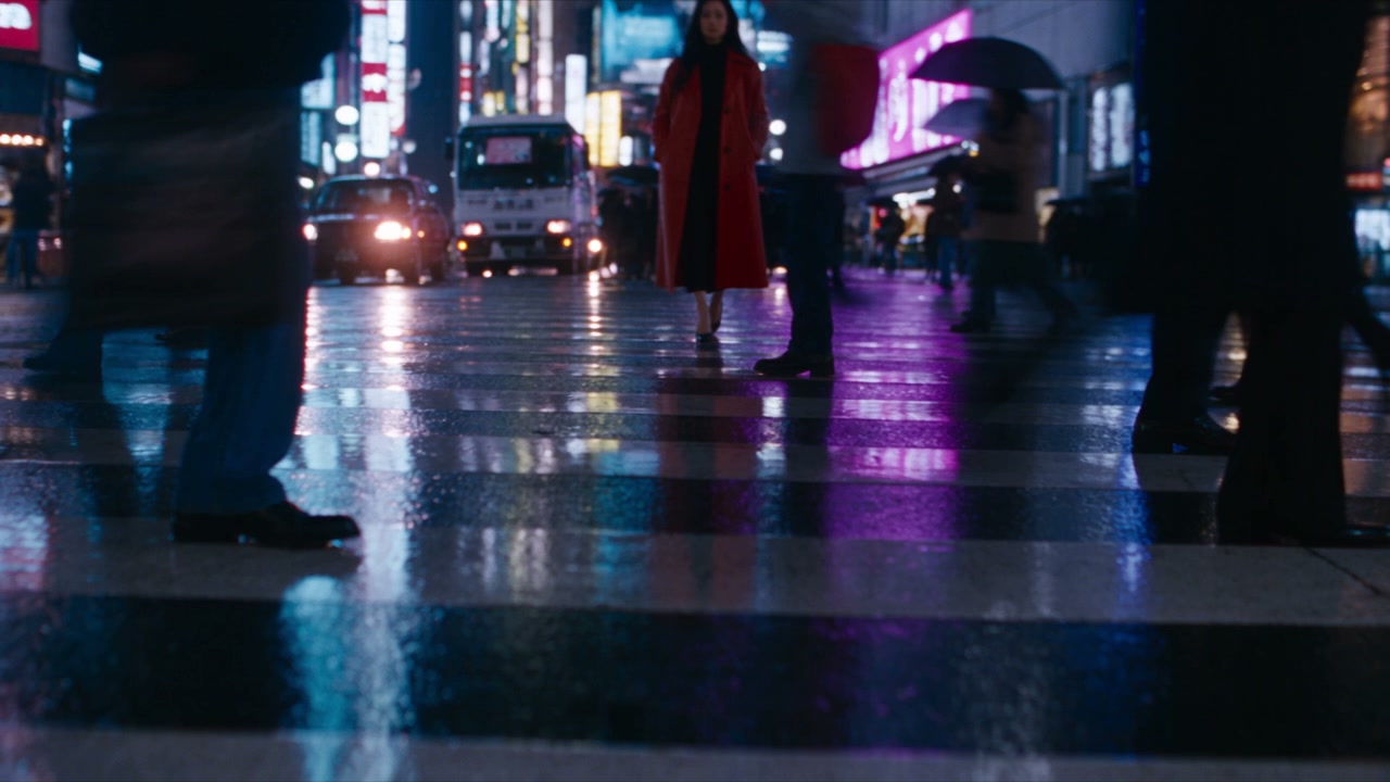 Seedance 2.5 sample: a vintage motorcycle rolls through a wet neon-lit alley at night, pink and cyan reflections rippling in puddles
