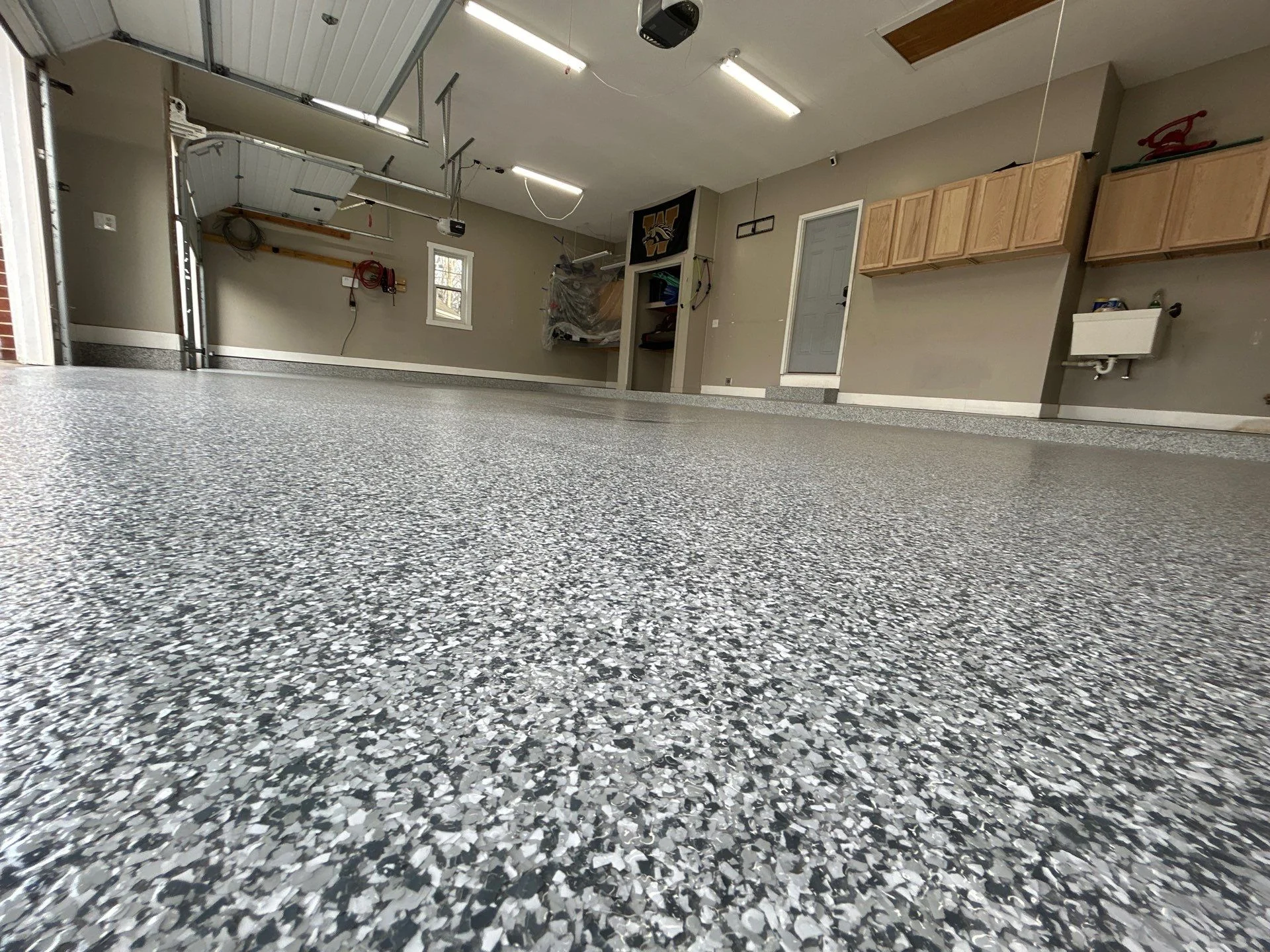 Upgrade Your Garage This Summer with Epoxy Floor Coating in Hudsonville and Beyond