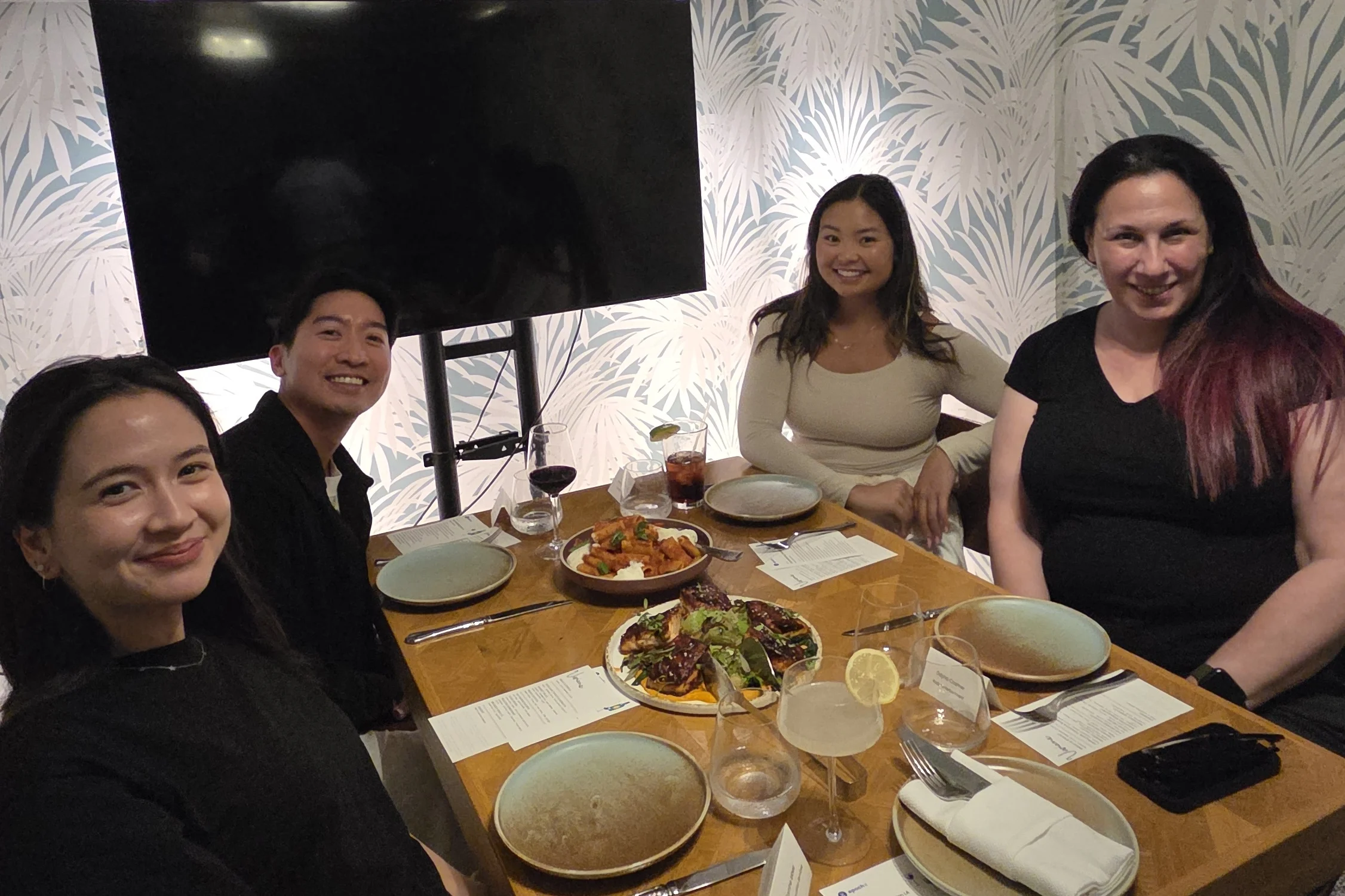 Four salon guests smiling together at Viviane at the Avalon