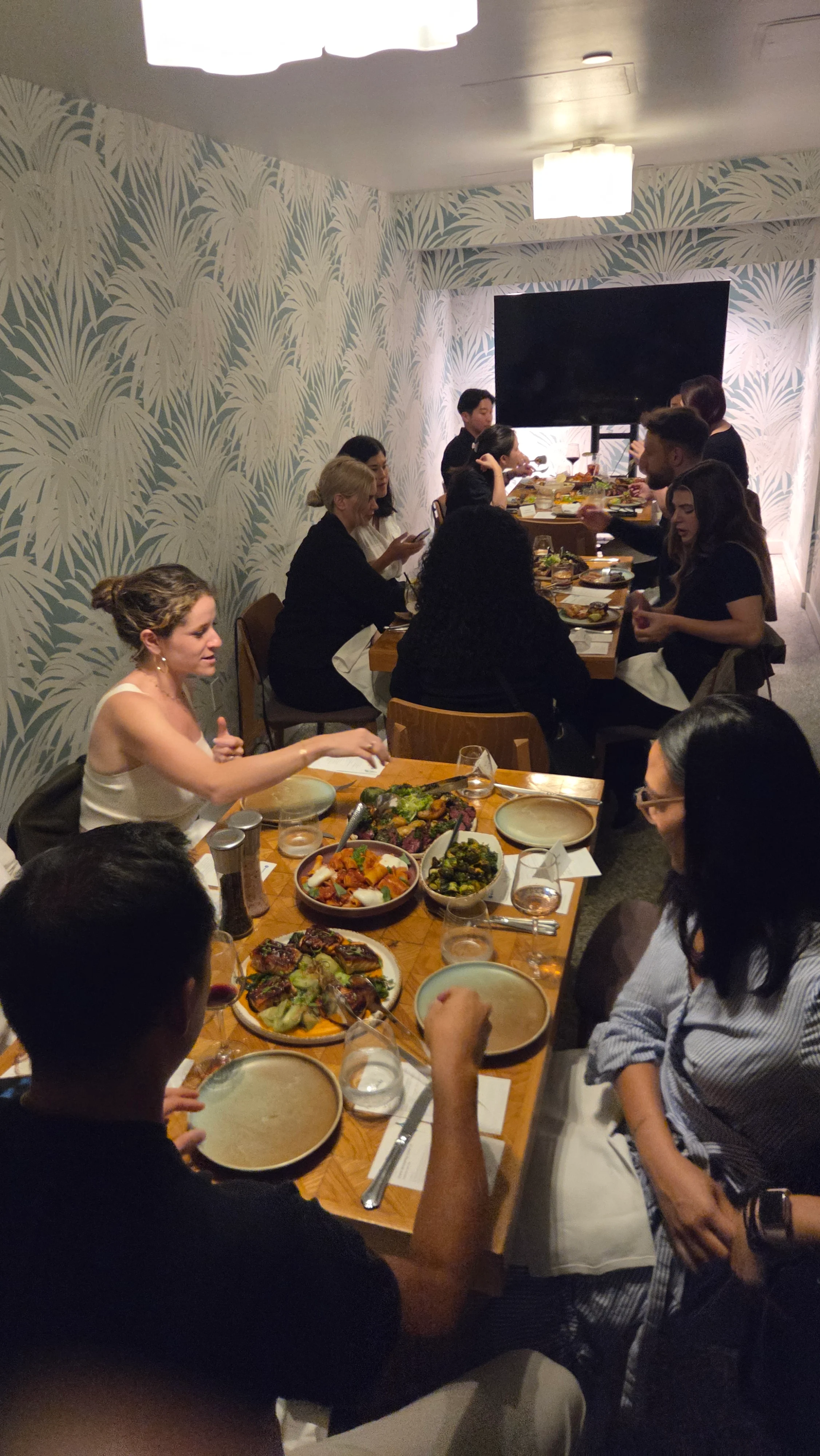 Guests sharing plates during the Beverly Hills salon dinner