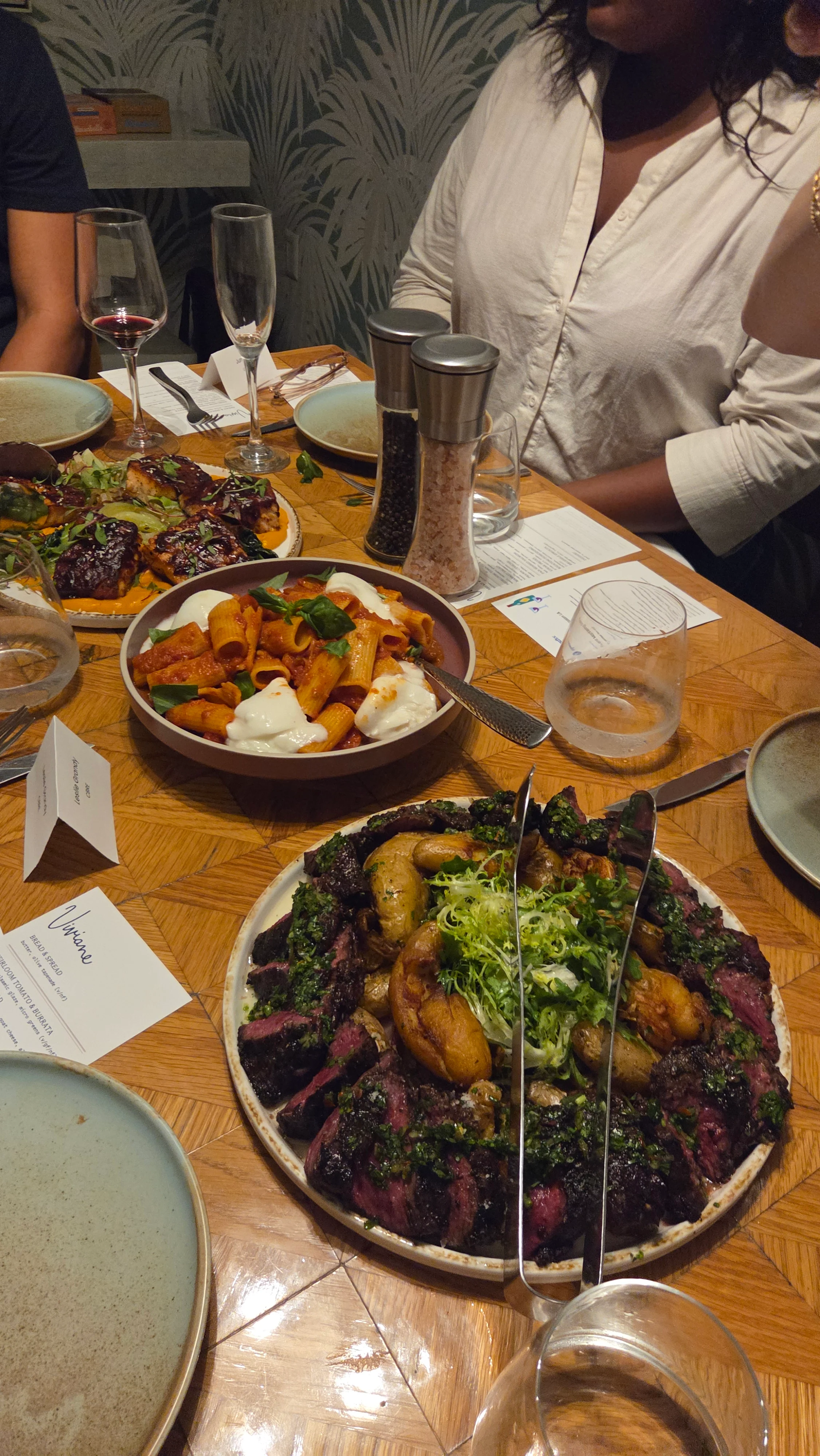 Shared dinner plates on the table at Viviane at the Avalon