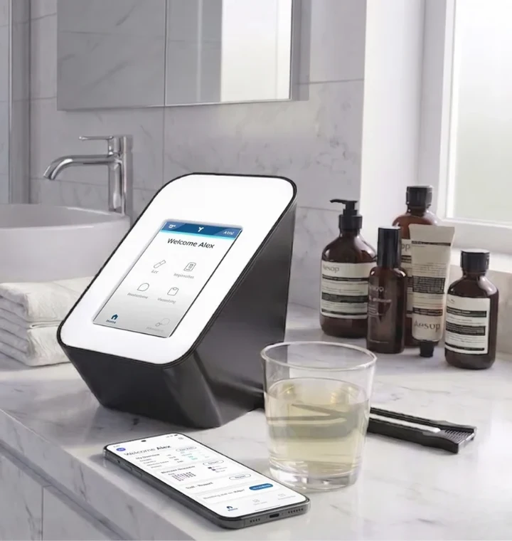 BodyCheck device, companion app on a phone and loading tray on a bathroom counter