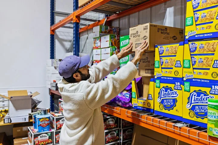 Small-business owner stocking inventory inside a WareSpace unit