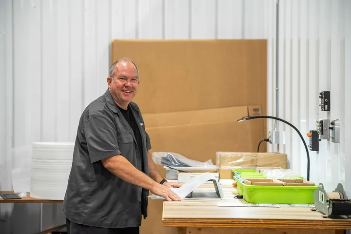 Small-business owner assembling products at a WareSpace worktable
