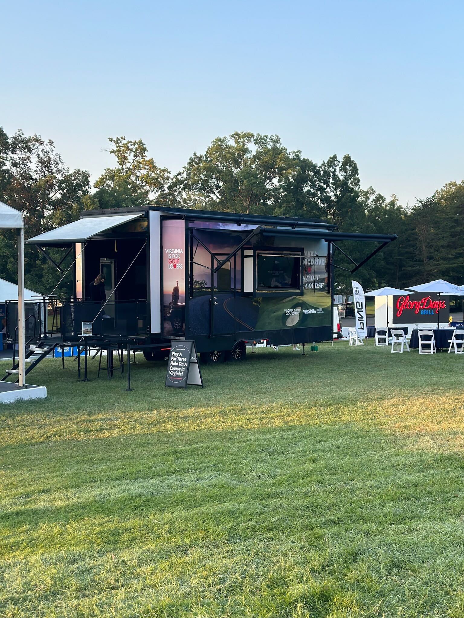 Virginia is for Golf Lovers Dryvebox trailer activation at the Solheim Cup with par-three course signage